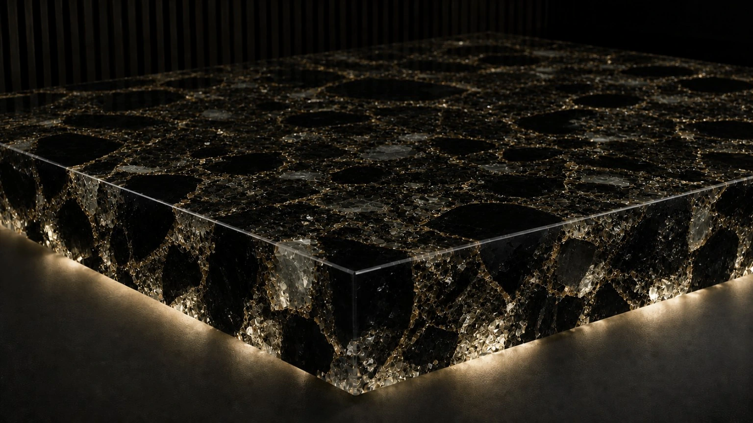 Black resin worktop concept with translucent fragments and restrained gold-toned accents