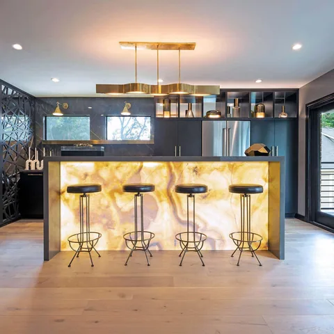 Modern kitchen with illuminated stone island