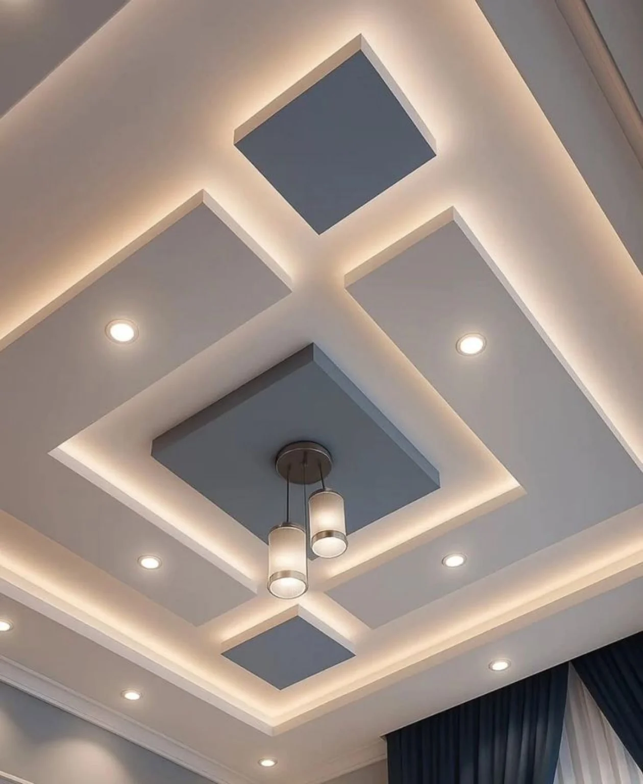 Multi-level geometric ceiling with illuminated recesses and integrated downlights